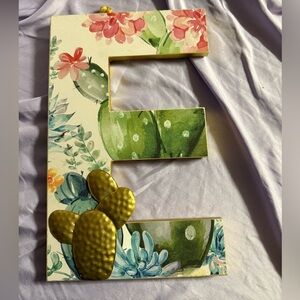 Decorated letter E wall decor